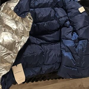 Brand new ferragamo winter coat . Navy blue and silver with tags . Reversible .